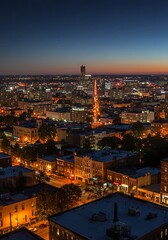 Obraz premium City Skyline at Twilight with Illuminated Buildings and Starry Sky