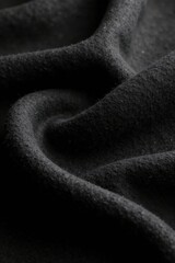 Fototapeta premium Dark Textile Draped in Soft, Luxurious Folds, Showing Texture and Subtle Shadow Play