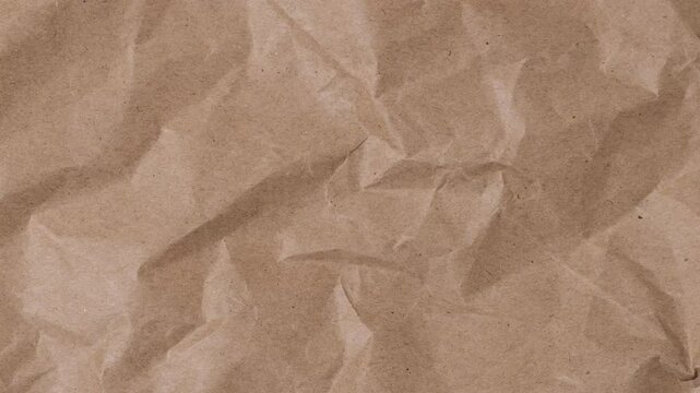 Crumpled brown paper stop motion animation, Textured paper background. The concept of sketch pad, design, retro style, wrinkle, frayed, blank