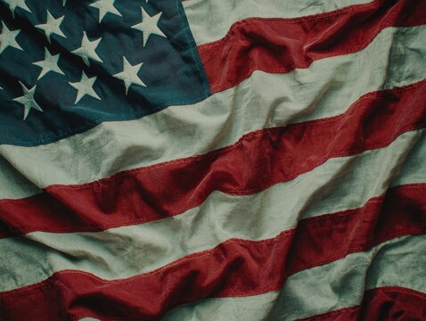 Close-up of a waving American flag, symbolizing freedom.