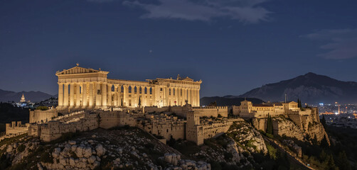 Fototapeta premium Generate an image of the Panathenaic Stadium in Athens at night, with the ancient structure glowing under the night sky.