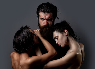 Sensual threesome kiss. Intimate relationship and sexual relations. Passion and sensual. Couple In...