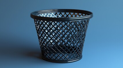 A detailed view of a black plastic wastebasket on a smooth blue surface, showcasing its intricate design