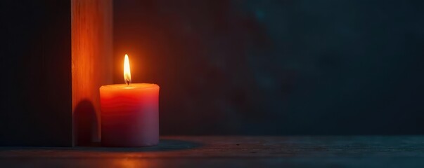 A lone candle flame burns brightly against darkened walls, candle flame, minimalist decor