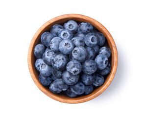 Flat lay of blueberries in wooden bowl isolated on white. Clipping path.