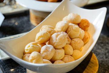 Choux pastry in a concave plate
