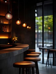 A modern bar interior featuring dim lighting, sleek stools, and large windows, creating an inviting atmosphere.