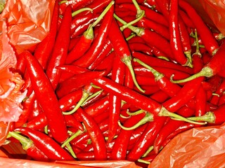 Top View of Fresh Spicy Red Chilli Peppers (Cabe Merah Besar) at Traditional Market. Detailed Texture, Pattern, and Background.