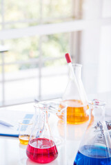 Vertical Horizon Science laboratory chemistry test science lab with microscope glass tubes on white table scientific background. Vertical Colorful Liquid biology scientist laboratory chemical fluid