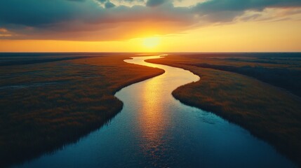 Sunset River Aerial Winding waterway through wetlands at golden hour