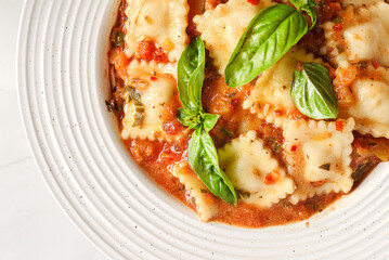 ravioli in tomato sauce with basil