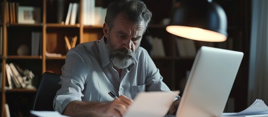 Fototapeta premium A businessman accountant holding to checking document papers near laptop in office. AI generated