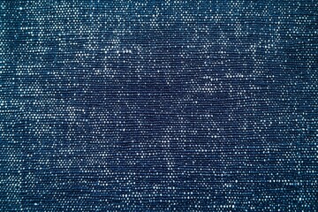 Navy Blue Denim Texture: A detailed close-up shot reveals the rich texture of navy blue denim fabric, showcasing its intricate weave and subtle variations in tone.