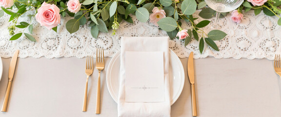 Elegant wedding table setting with floral decor and lace runner, celebration