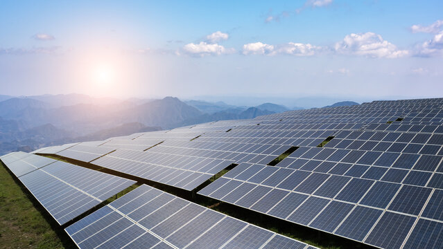 Captivating Solar Panel Field Overlooking Majestic Mountain Landscape