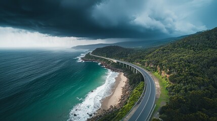 Fototapeta premium Scenic Coastal Road Amidst Dramatic Sky and Ocean Waves
