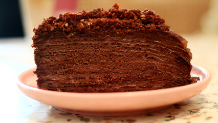 Chocolate mille crepes. A cake consisting of layers of stacked crepes with a cream filling.