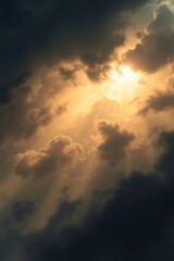 Fototapeta premium Sun Rays Streaming Through Dramatic Clouds Creating a Golden Sky