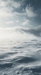 Fototapeta premium Serene Winter Landscape with Snowy Waves and Cloudy Sky