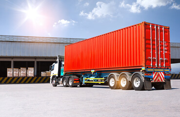 Container Trucks Loading at Warehouse Dock. Bulk of Package Boxes to be Loaded into Shipping Containers. Distribution Warehouse. Supply Chain, Shipment. Freight Truck Logistics Transportation.	
