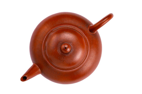 Top view of old clay chinese teapot isolated on white background with clipping path.