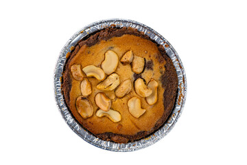 Top view of nut chocolate cake in foil baking cup isolated on white background with clipping path.