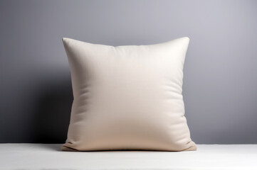 Beige fabric pillow on a cozy couch, mockup with space for text, minimalist home decor concept