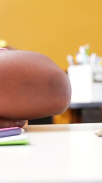 School kids sleeping on desk in classroom