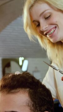 Man getting his hair trimmed with scissor