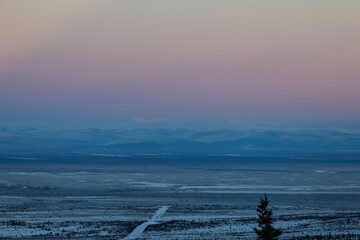 Colorful pink sky over mountain in interior Alaska.