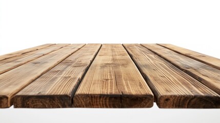 A wooden table with a white wall behind it