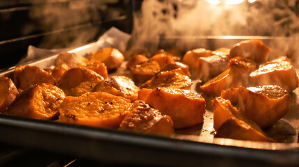 A tray of roasted potatoes with a lot of seasoning on them