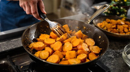 A tray of roasted potatoes with a lot of seasoning on them