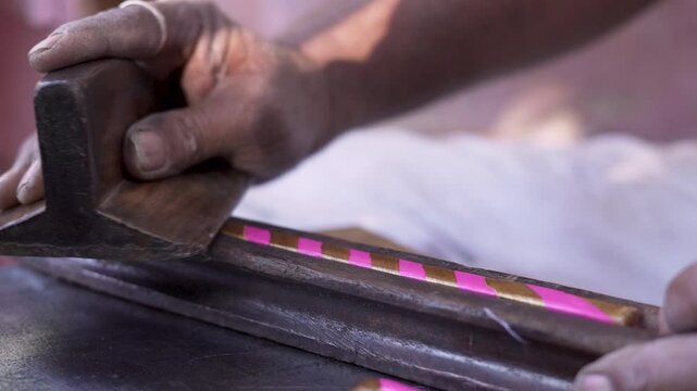 Artisan crafting Lac bangles by hands