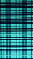 Fototapeta premium Colorful plaid textile pattern showcasing vibrant blue and green hues in perfect symmetry
