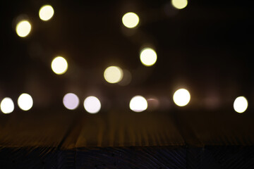 Warm Festive String Lights Against Dark Wooden Background