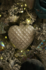 Elegant Christmas Ornament on Glittering Christmas Tree with Fairy Lights and Festive Decorations