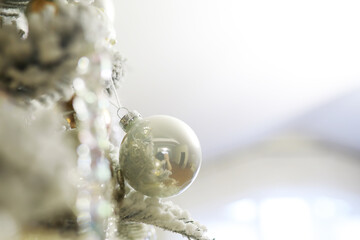 Close-Up of a Silver Christmas Ornament on a Decorated Christmas Tree