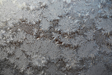Intricate Frost Patterns on Frozen Glass Window Close-Up