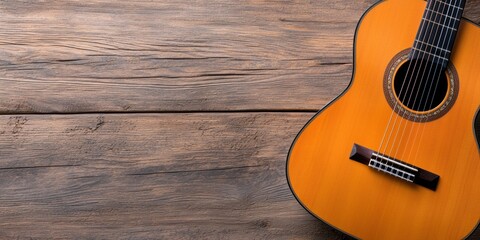Fototapeta premium A close-up of an acoustic guitar resting on a rustic wooden surface, showcasing its warm color and intricate details.