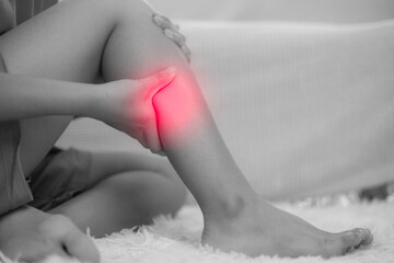 Deep vein thrombosis and varicose. Girl touching her legs and looking at veins. Sclerotherapy procedure at visiting vascular surgeon doctor