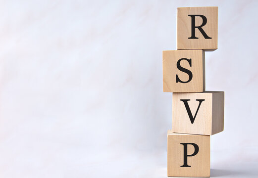 RSVP - acronym on wooden cubes on a white background