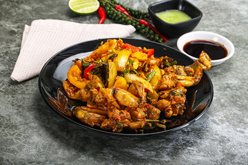 Vietnamese cuisine - fried frog with vegetables