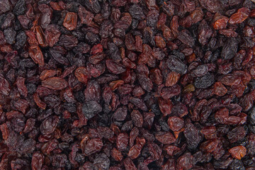 Dried raisins as a background. Top view.
