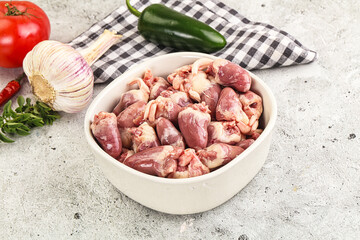 Fresh raw chicken hearts in the bowl