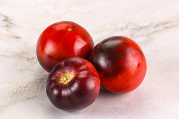 Black ripe juicy organic tomato