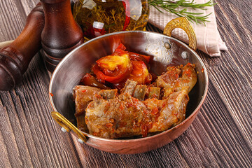 Baked lamb ribs with vegetables