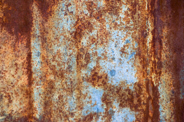 A lot of rust on old metal sheets used for designs and decorations.