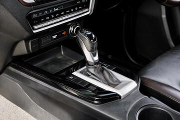 automatic transmission shift selector in the car interior. Closeup a manual shift of modern car gear shifter. 4x4 gear shift	