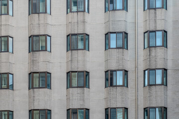 A collection of various exterior windows on buildings, showcasing diverse architectural styles and...